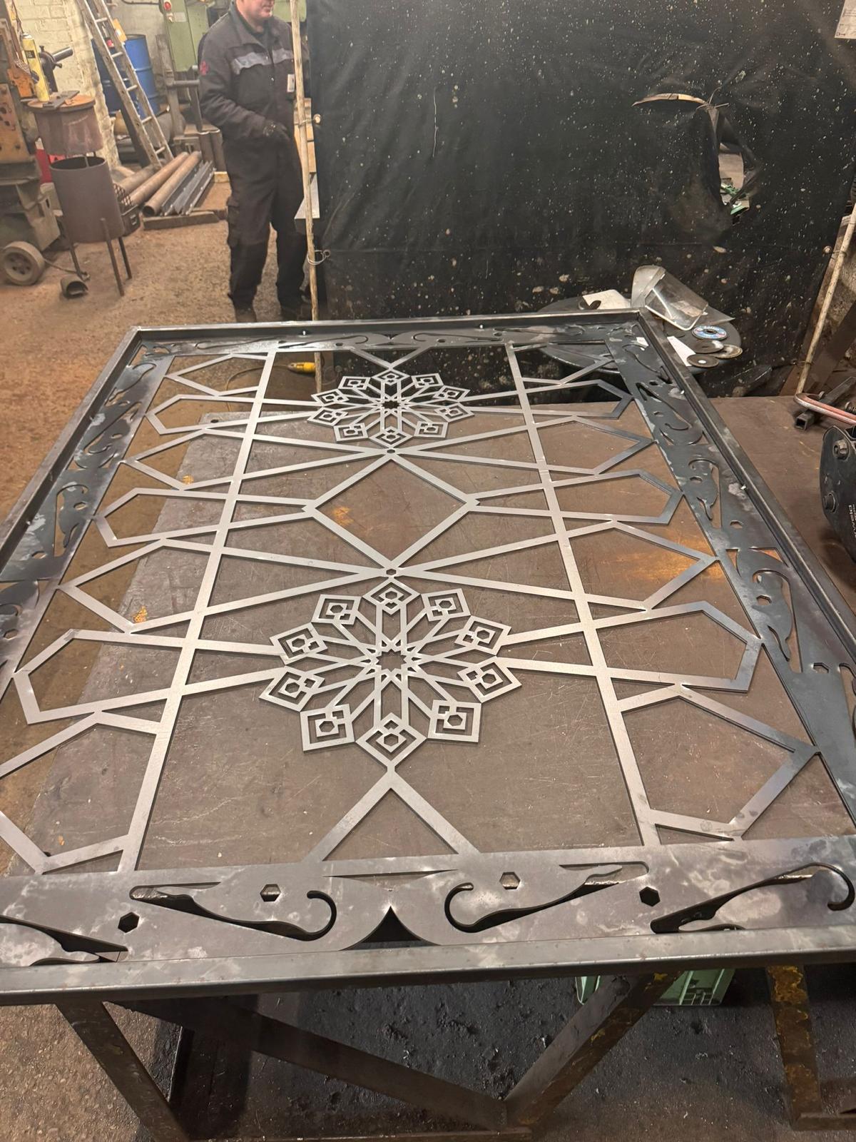 Bespoke CNC plasma-cut steel gate panel with geometric pattern being fabricated at Starweld Engineering, Sheffield